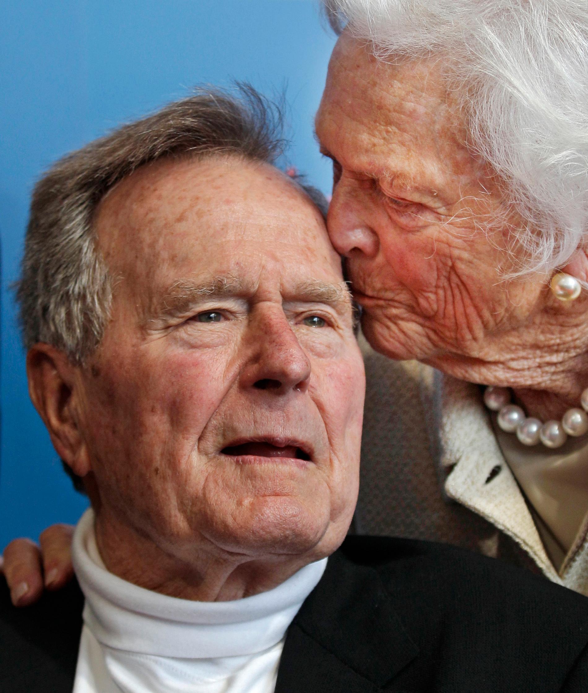 In this June 12, 2012 file photo, former President George H.W. Bush, and his wife, former first lady Barbara Bush, arrive for the premiere of HBO's new documentary on his life near the family compound in Kennebunkport, Maine.