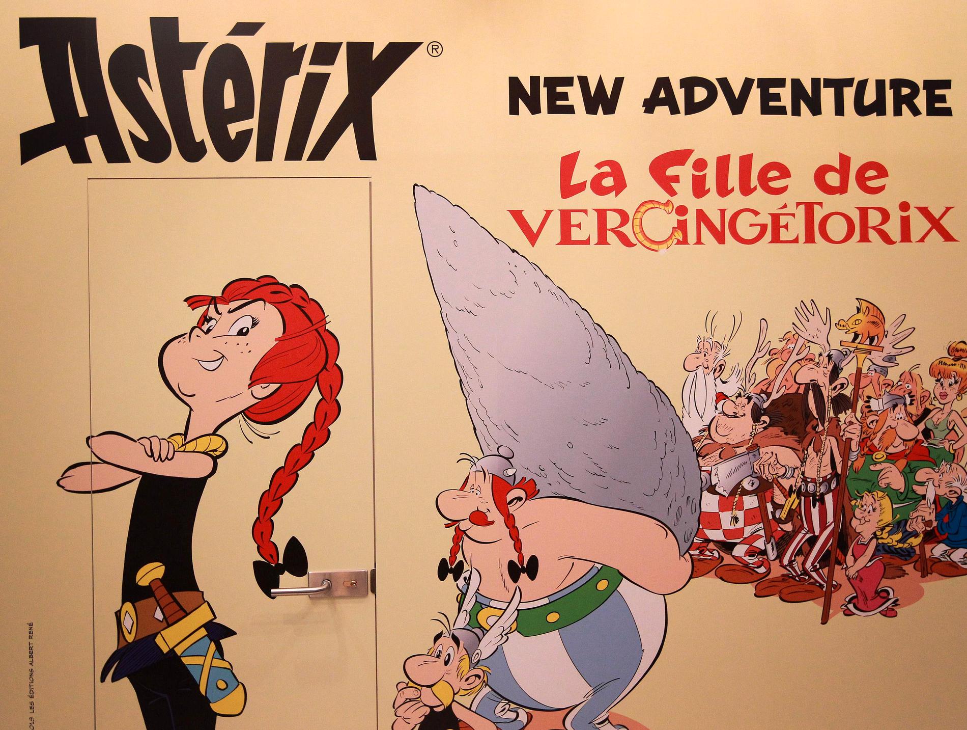 Ett litet steg för människan, ett bautasteg för Asterix. En reklamskylt för nya albumet "La fille de Vercingétorix".