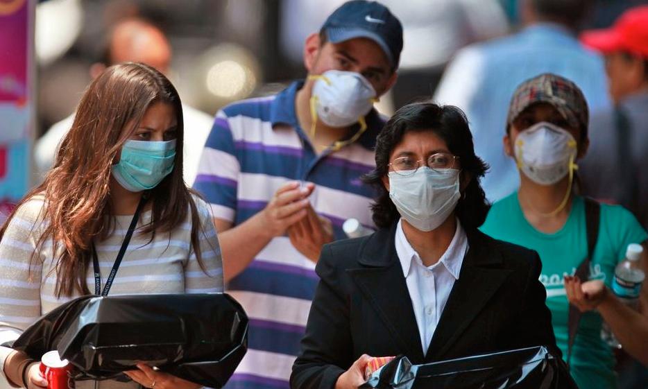 Mexico City, maj 2009 Människor med munskydd syntes överallt på gatorna.