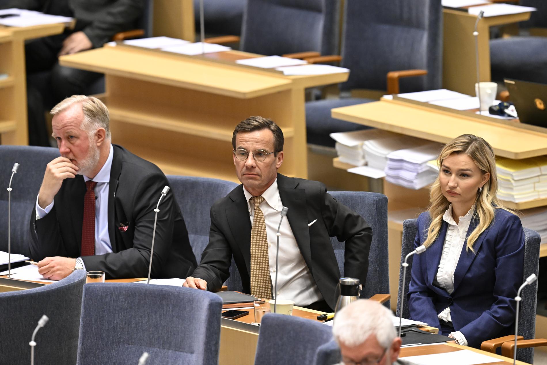 Liberalernas partiledare Johan Pehrson (L), Moderaternas partiledare Ulf Kristersson (M) och Kristdemokraternas partiledare Ebba Busch (KD) under förra veckans partiledardebatt i riksdagen.
