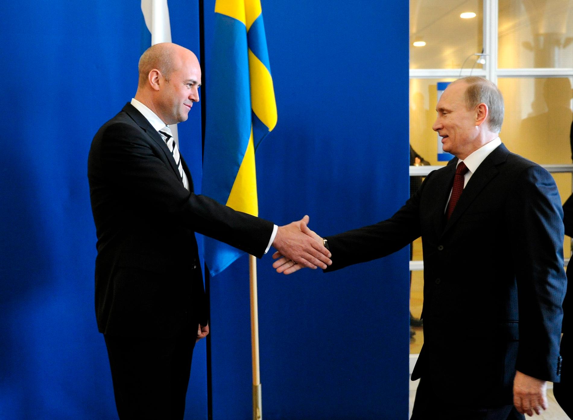 Glada miner mellan Rysslands premiärminister Vladimir Putin och statsminister Fredrik Reinfeldt på Rosenbad 2011.