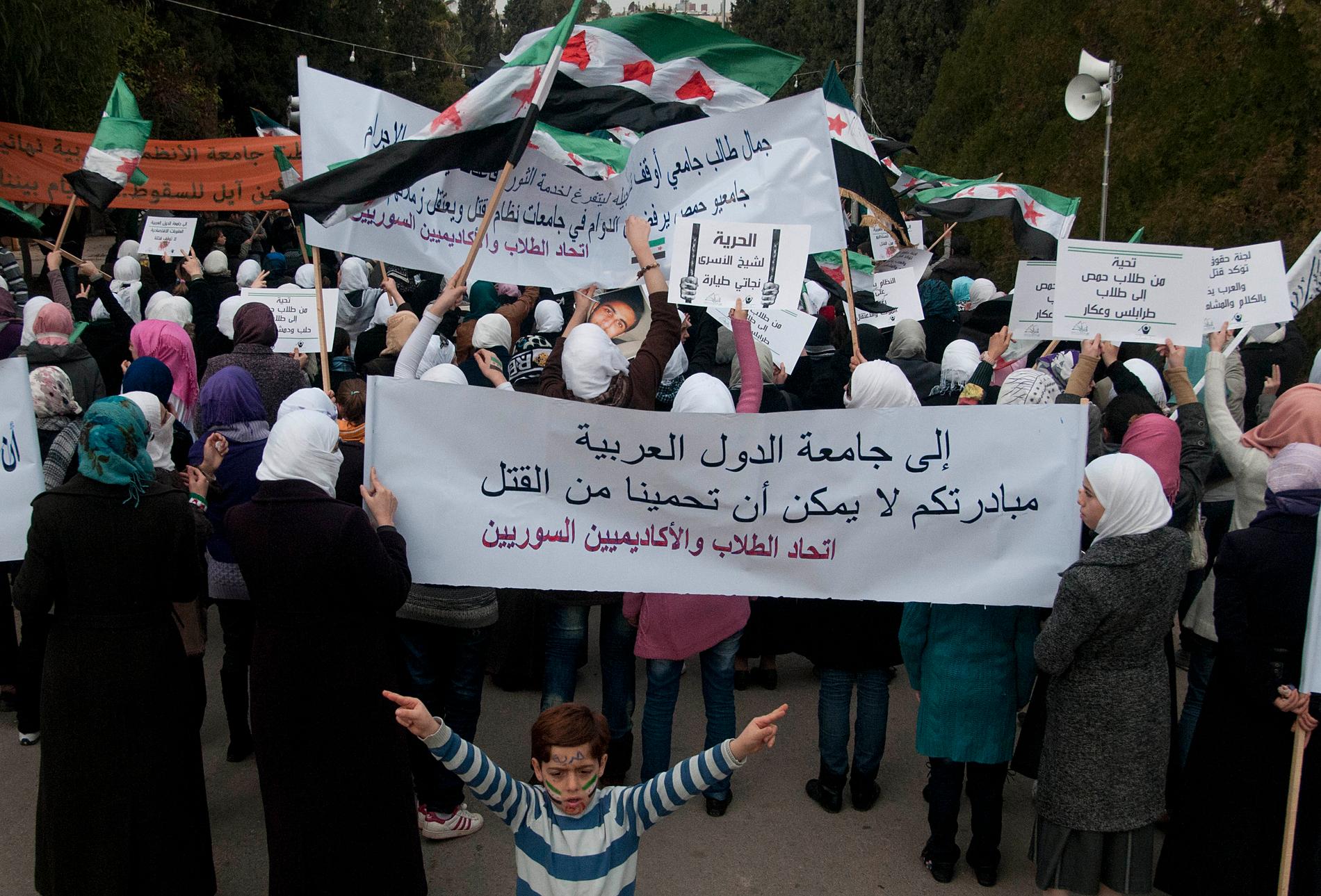 Protester mot regimen  i Homs 2011.