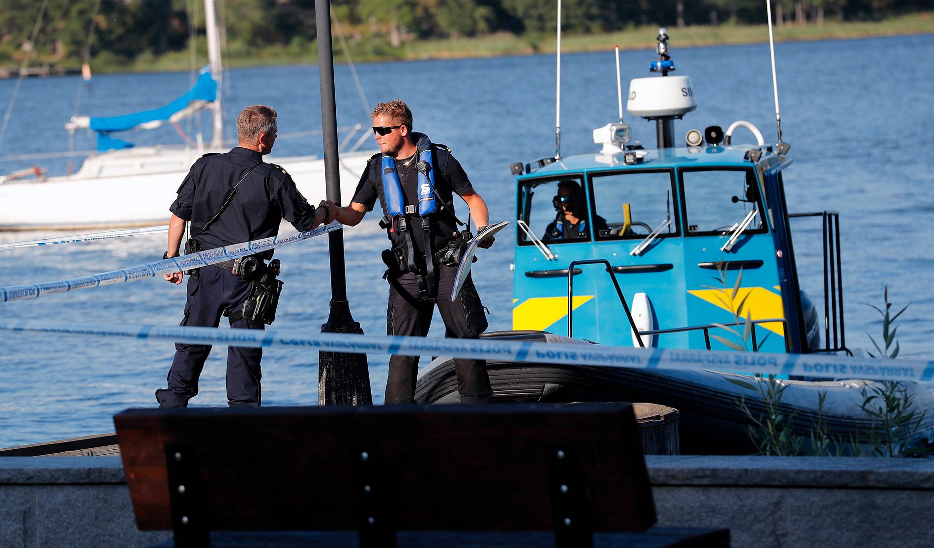 Police and coast guard after the robbery this summer. 