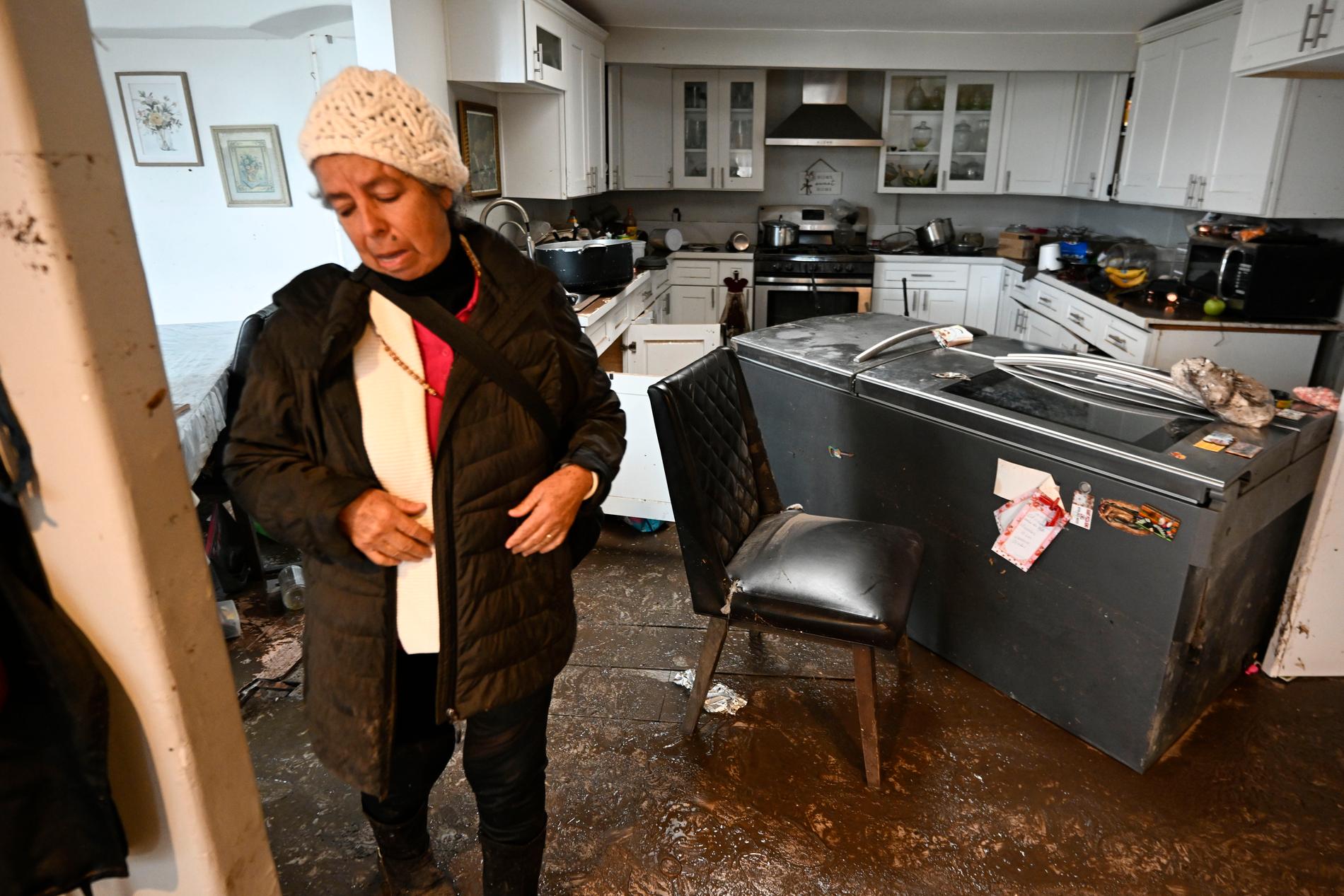 San Diego FloodingHomeowner Maria Ramirez walks through her flood damaged home Tuesday, Jan. 23, 2024, in San Diego. (AP Photo/Denis Poroy)  CADP101 