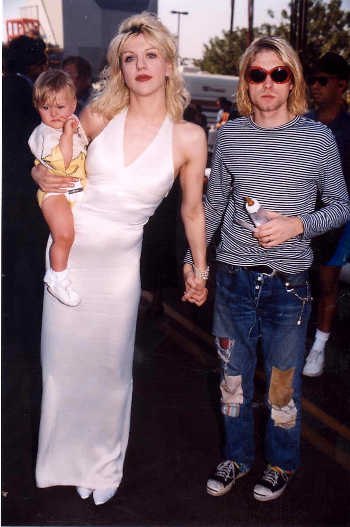 Courtney Love och Kurt Cobain med dottern.