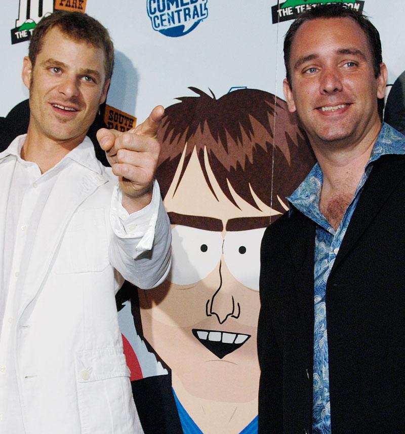 Matt Stone och Trey Parker, med sin bild av Tom Cruise i mitten.