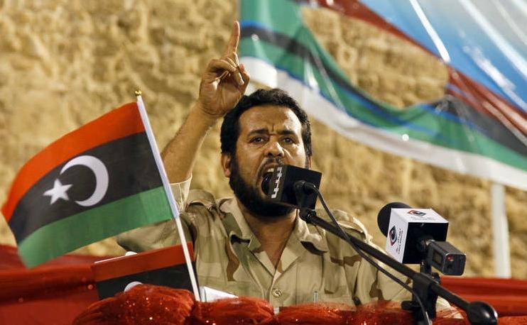 Rebellernas ledare Abdel Hakim Belhaj talade på Gröna torget under fredagen.