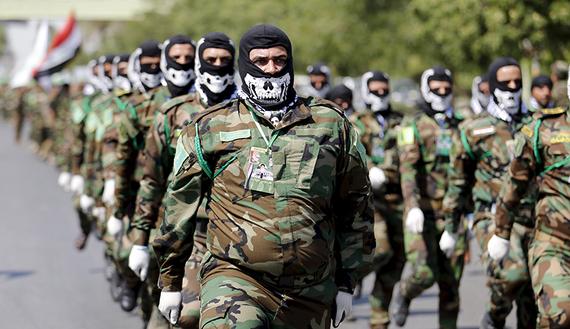PMU-trupper paraderar i Bagdad i juli 2015. Foto: REUTERS/Thaier al-Sudani