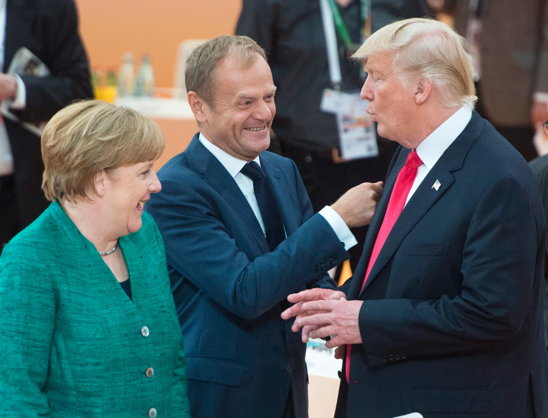 Tysklands förbundskansler Angela Merkel, EU:s permanente rådsordförande Donald Tusk och USA:s president Donald Trump vid fjolårets G20-möte i tyska Hamburg.