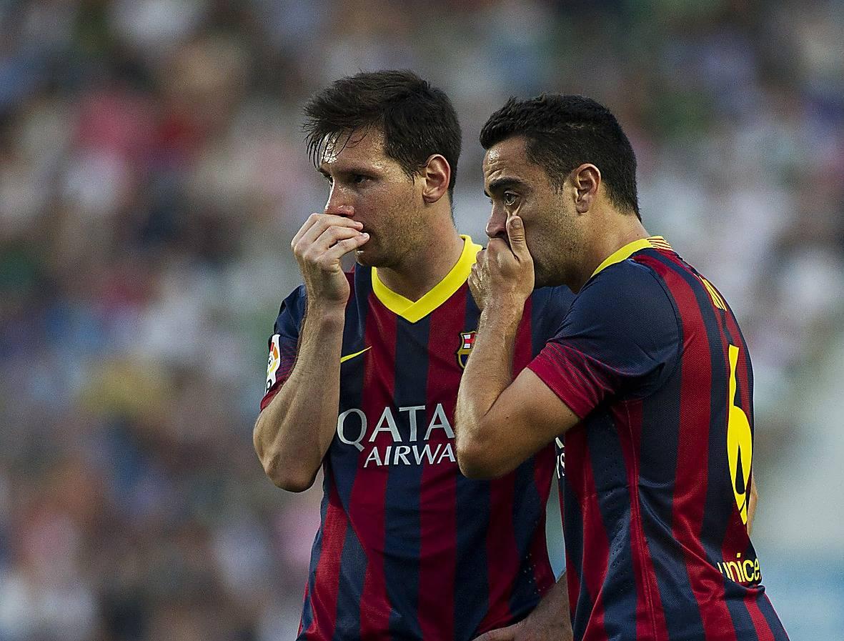 Messi och Xavi.