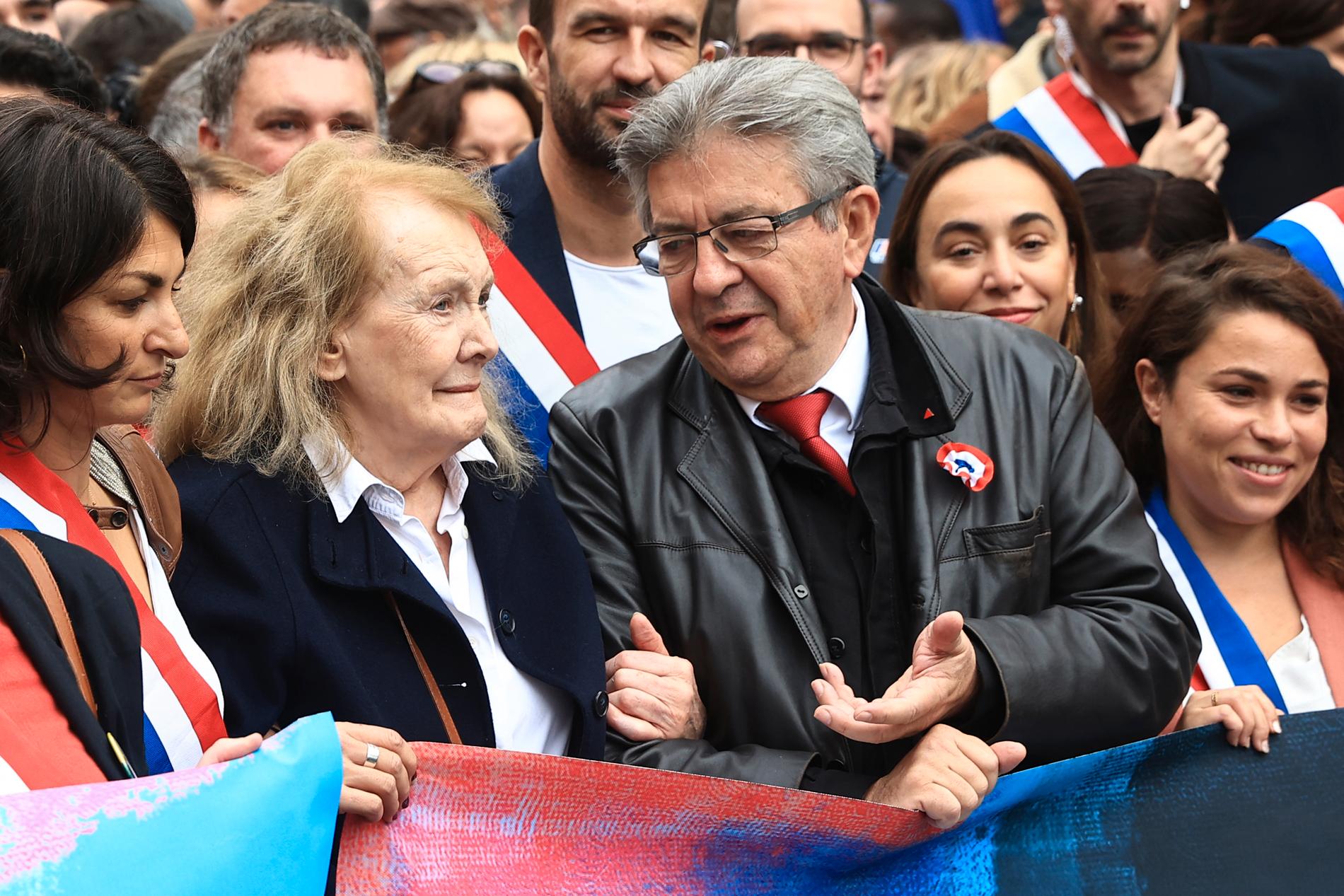 Här tillsammans med oppositionsledaren Jean-Luc Mélenchon.