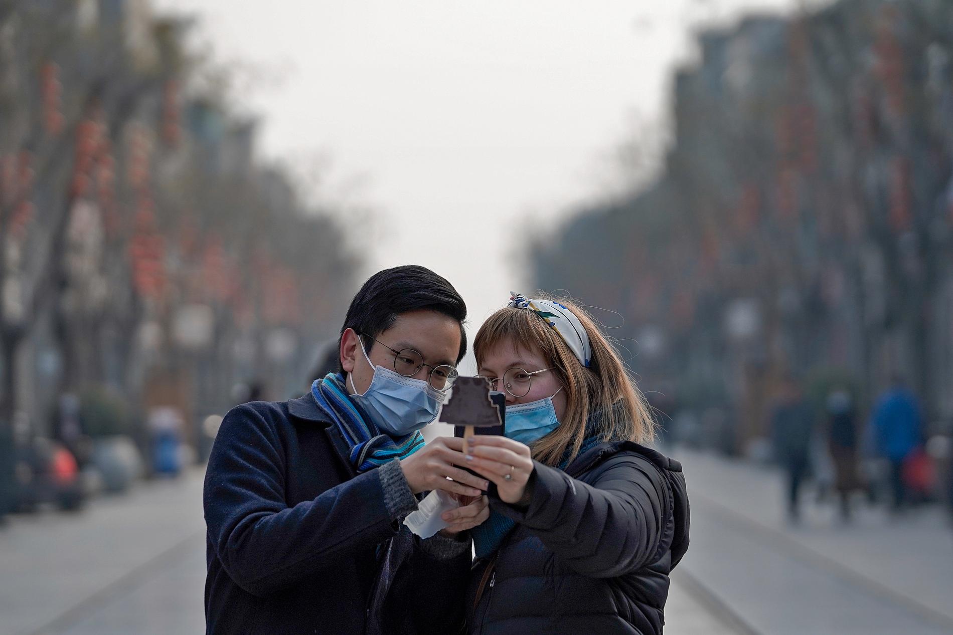 Turister tar en selfie i Kinas huvudstad Peking. 