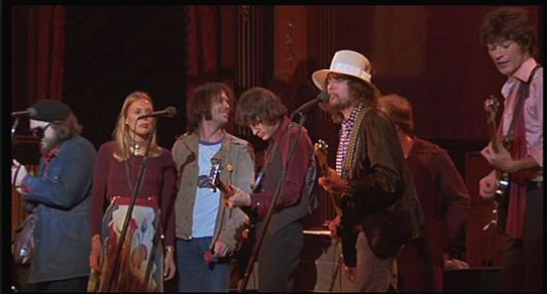 Sista valsen. Dr John, Joni Mitchell, Neil Young, Rick Danko, Bob Dylan och Robbie Robertson ”I shall be released” vid ”The last waltz” – sedan var The Band över, krossade av droger.
