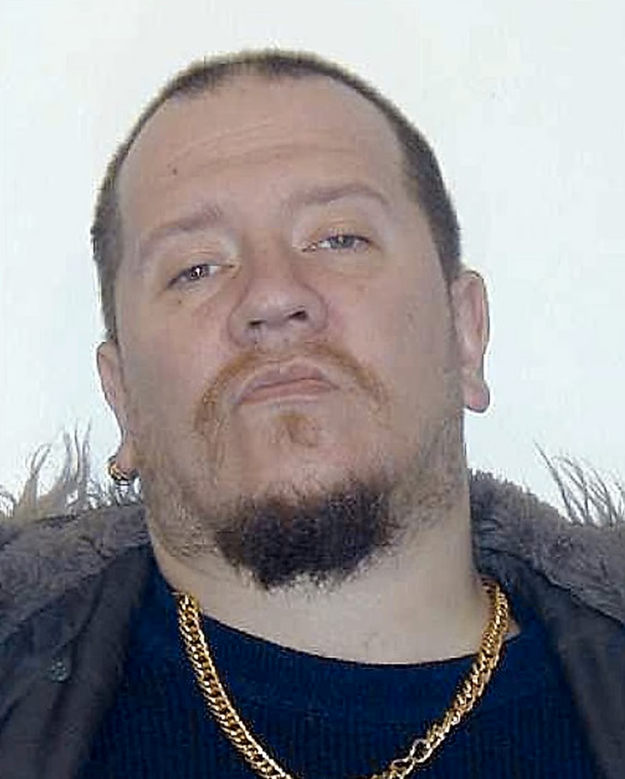 Juha Valjakkala, eller Nikita Fouganthine som han hette då, efter att ha gripits av polis i Helsingfors 2011.