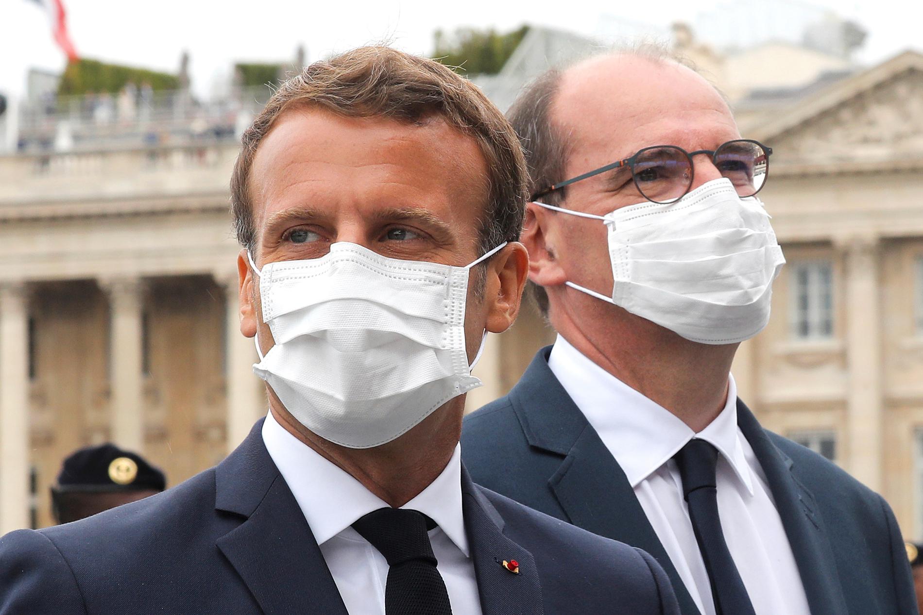 Frankrikes president Emmanuel Macron och premiärminister Jean Castex i munskydd under det franska nationaldagsfirandet tidigare i veckan.