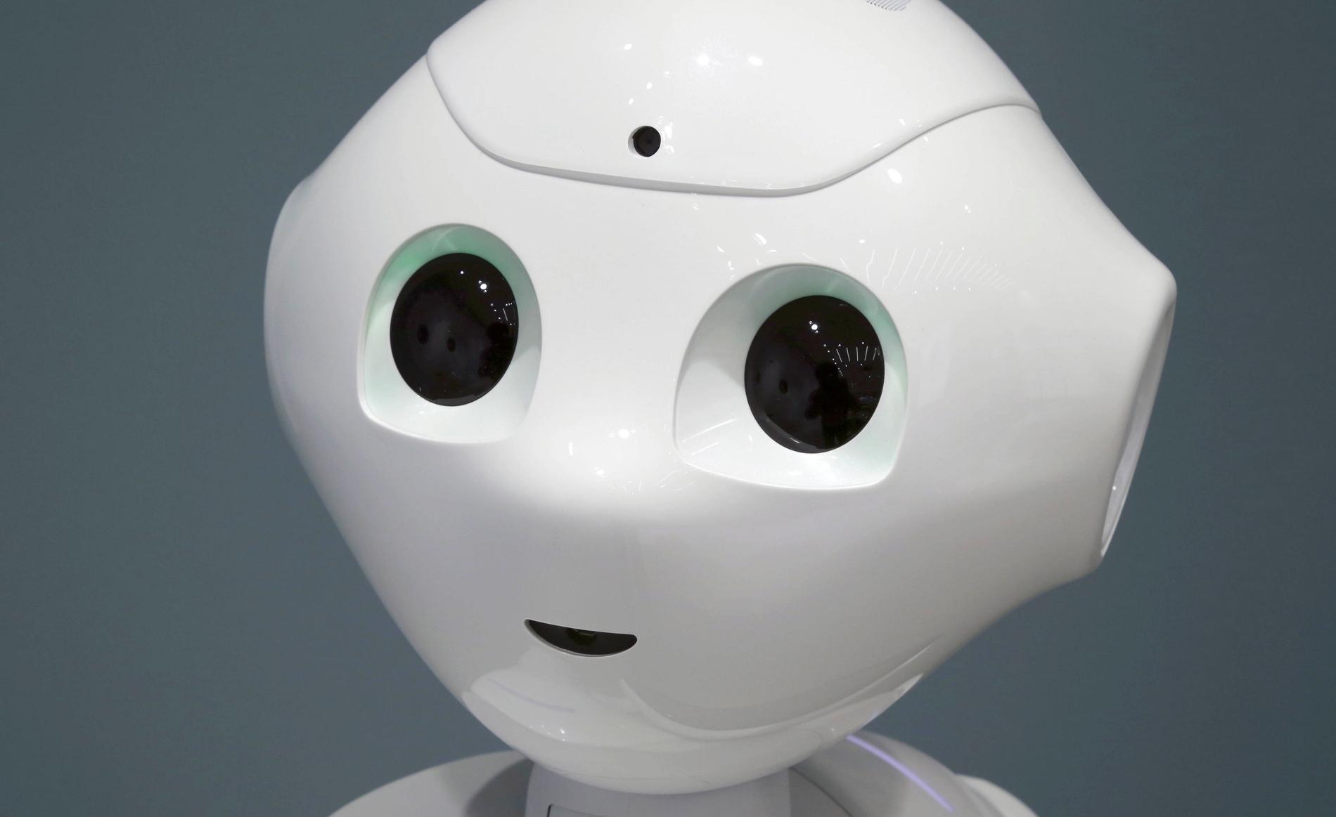 Den söta lilla roboten med stora ögon som kan blinka. 