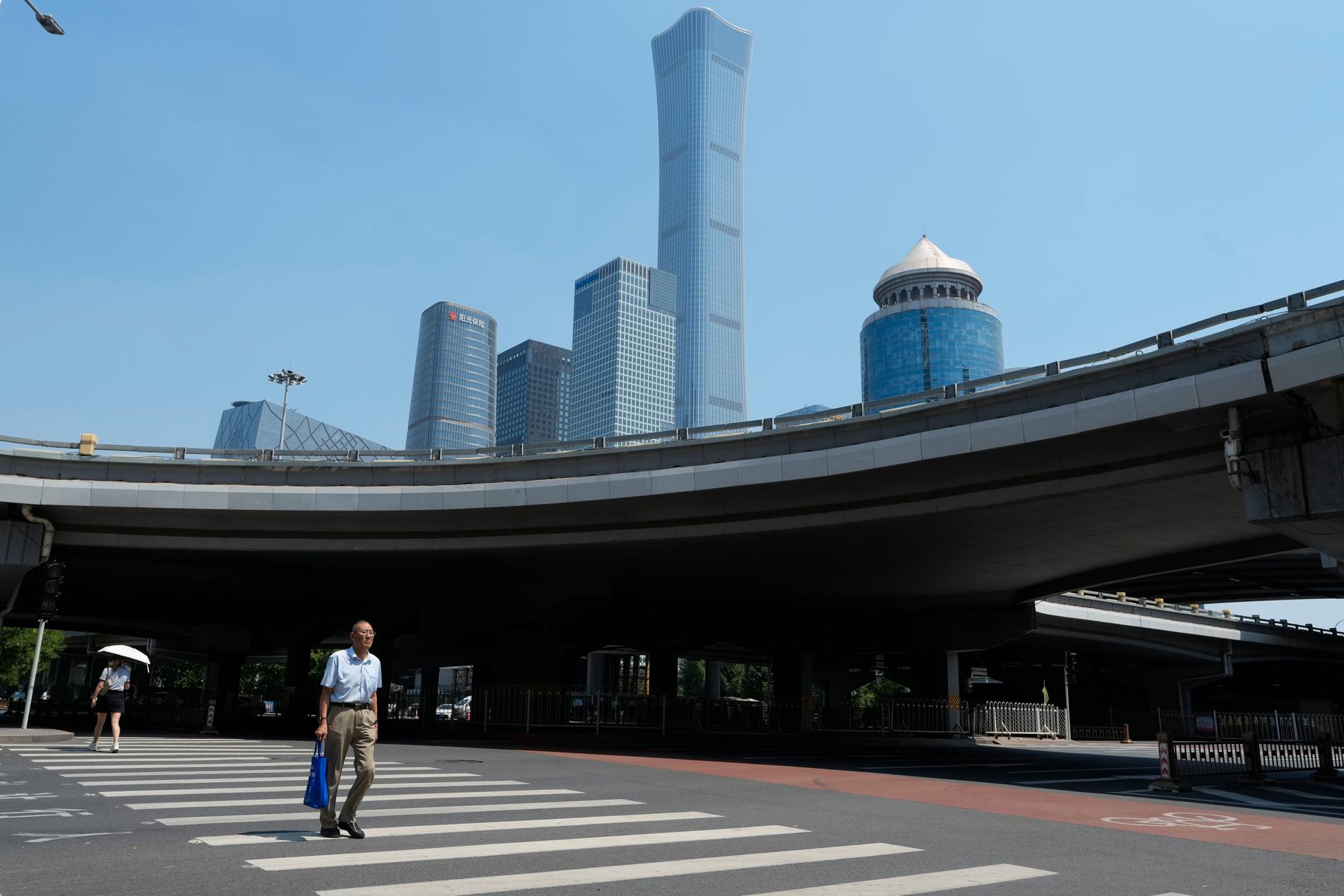 Den kinesiska ekonomin saktar in. I bakgrunden Pekings centrala finansdistrikt.