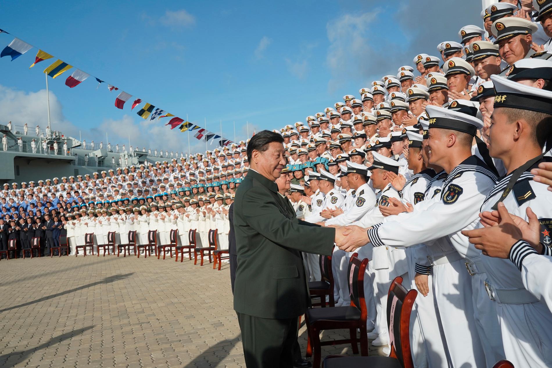 Kinas president Xi Jinping, här vid ett flottbesök i Sanya i södra Kina 2019.