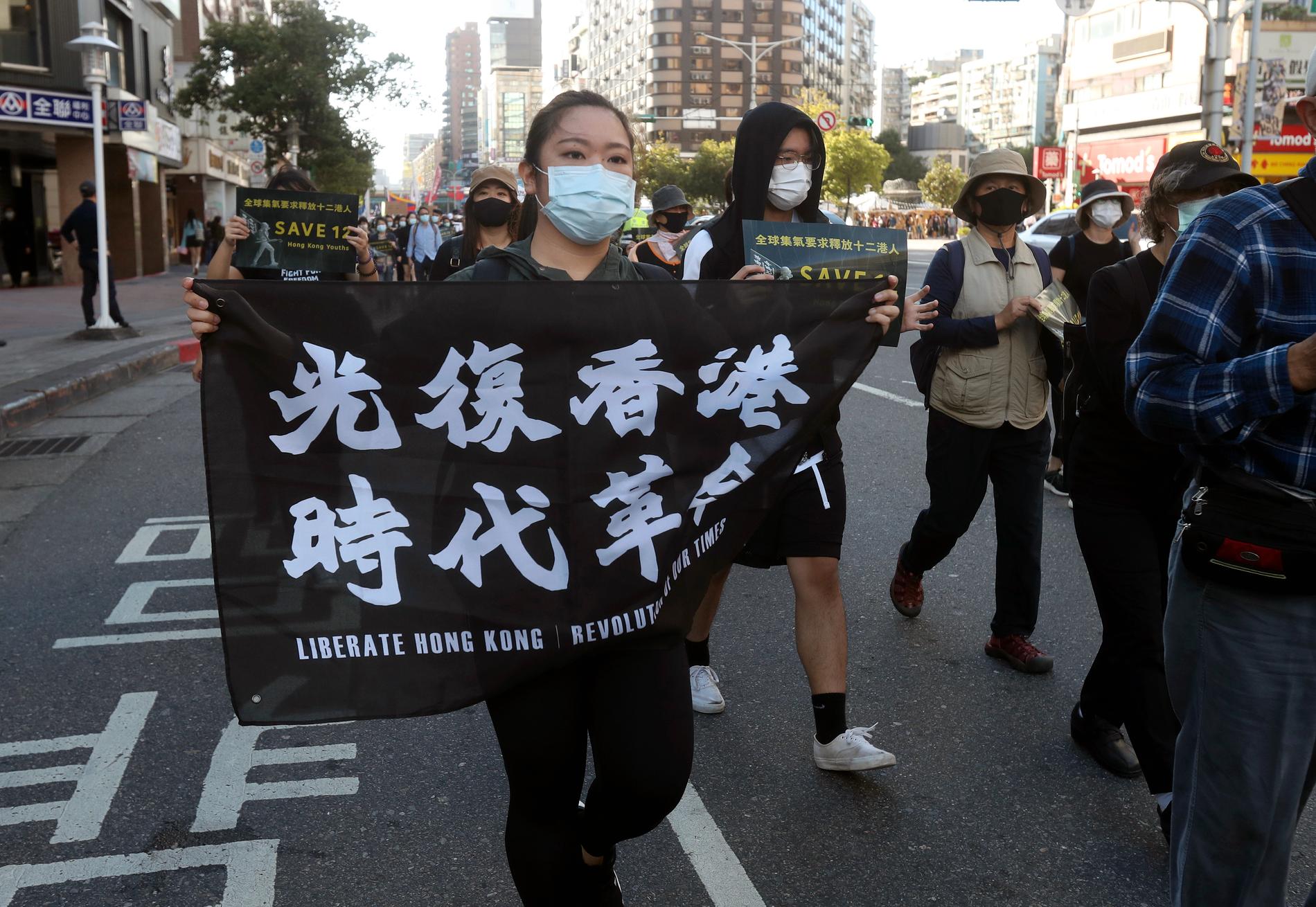 Protester till stöd för Hongkongbor i Taipei, Taiwan i oktober 2020.