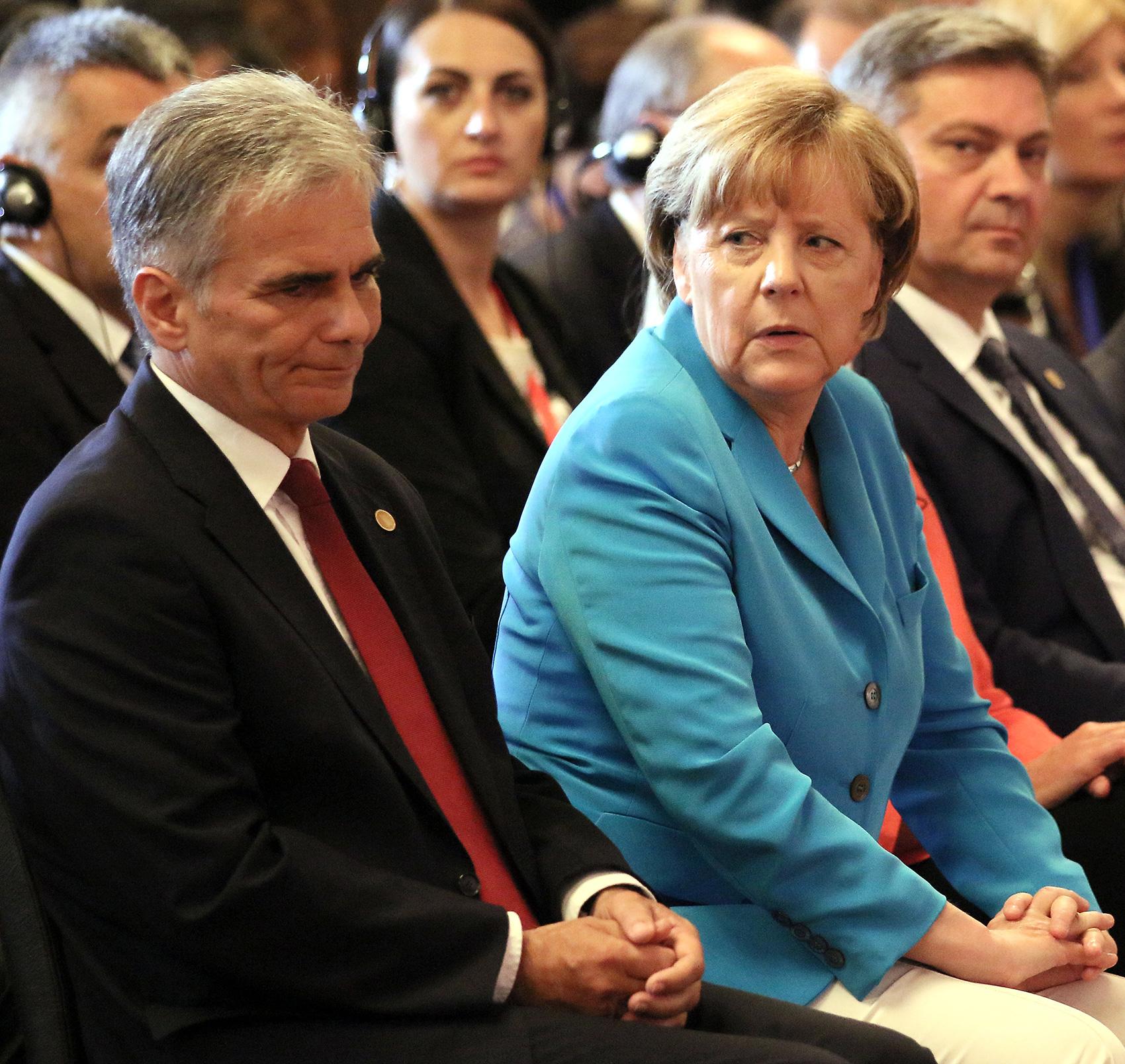 Österrikes förbundskansler Werner Faymann och Tysklands förbundskansler Angela Merkel.