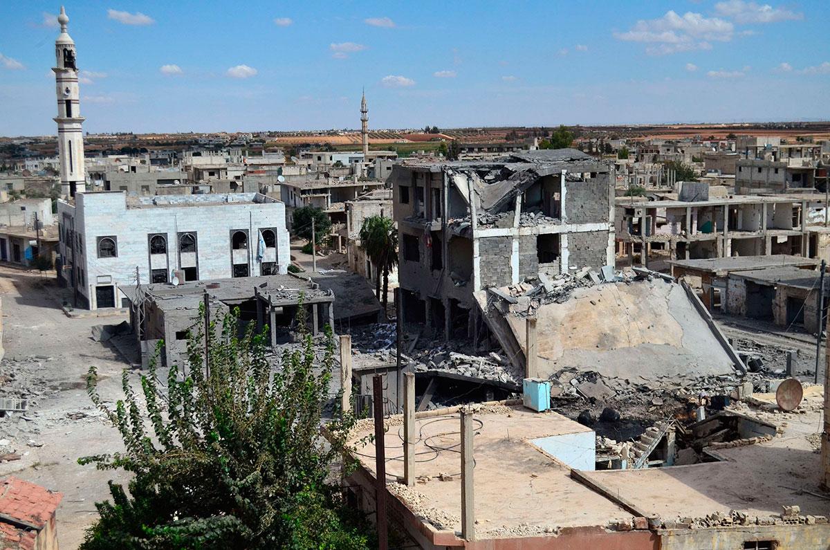 På bilden som är tagen den 30 september syns övergivna gator och förstörda byggnader i den syriska staden Talbisseh.