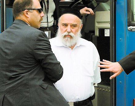 Levy Izhak Rosenbaum being led away by FBI agents. Rosenbaum is alleged to have functioned as a middleman in the illegal organ trafficking scheme.