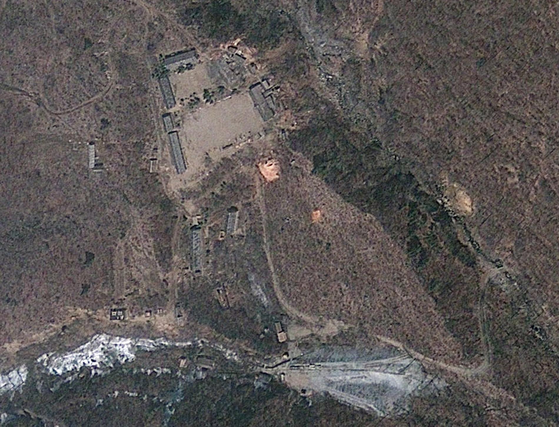 Satellitbild av testanläggningen Punggye-ri. Arkivbild.