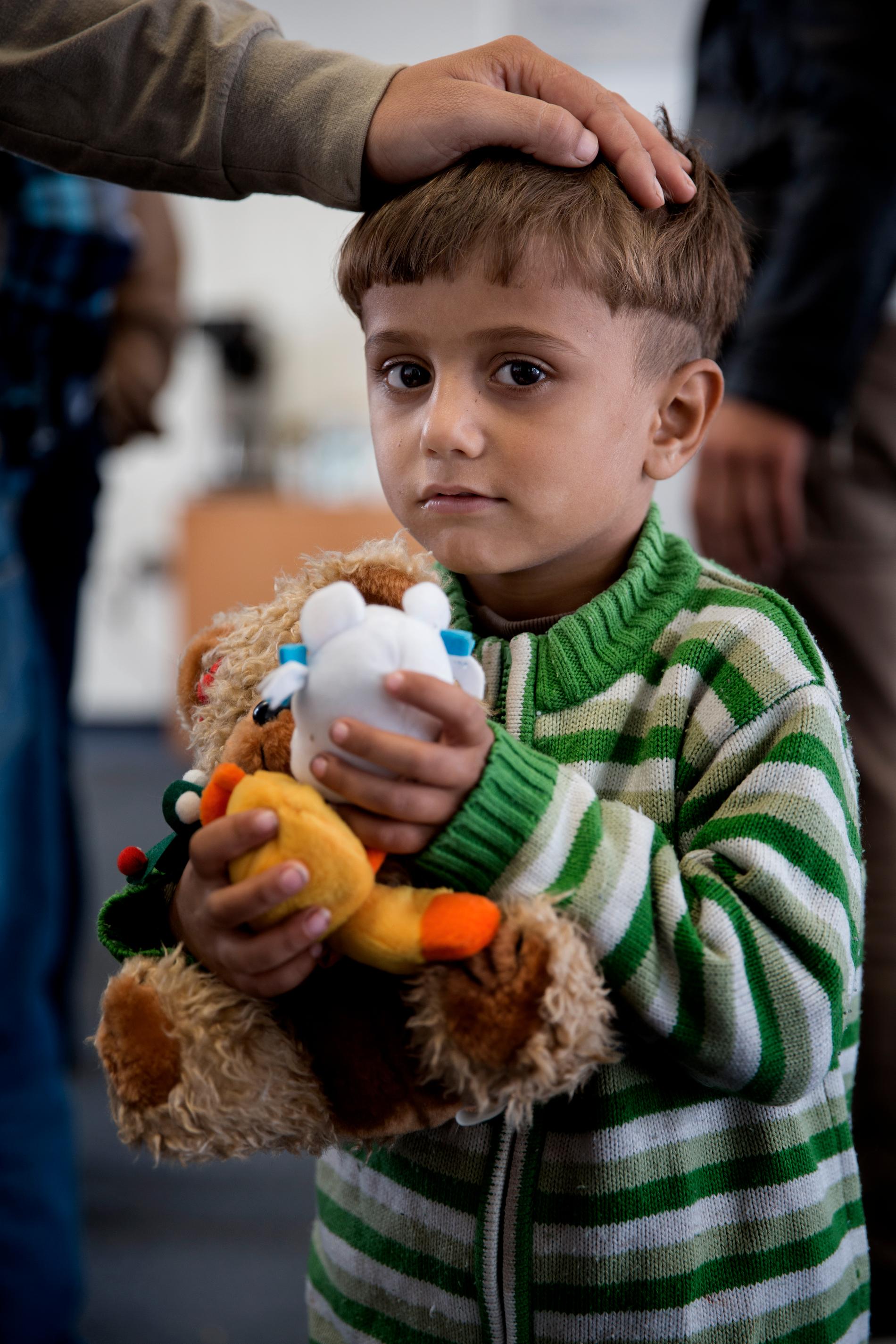 Flyktingar på ett mottagningscenter i München. Janiar, 4 år.
