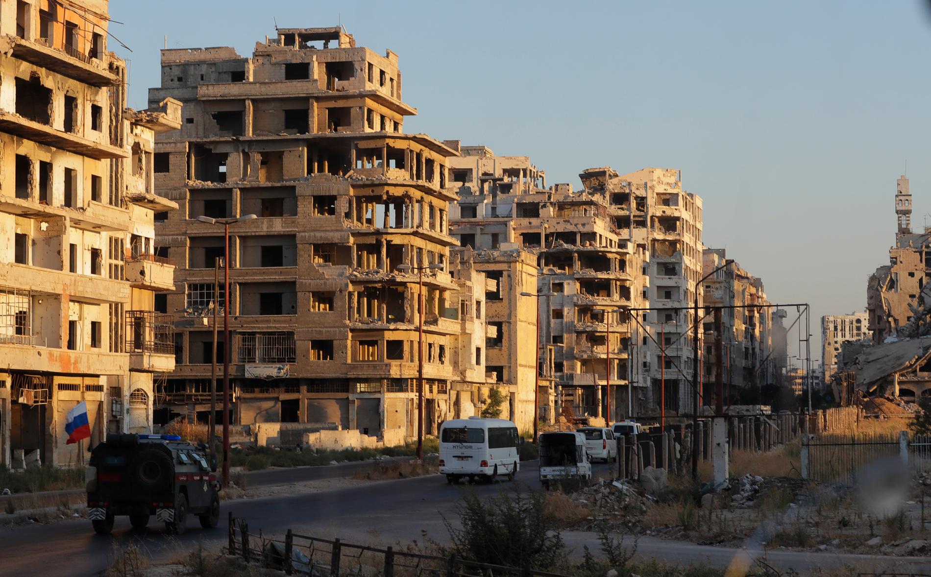 En illa krigshärjad del av staden Homs. Arkivbild.