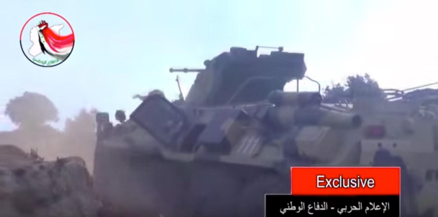 Syrisk tv har visat filmklipp på vad som uppges vara ryska marktrupper och militära fordon i gemensam strid med al-Assads trupper mot syriska rebeller i hamnstaden Latakia.