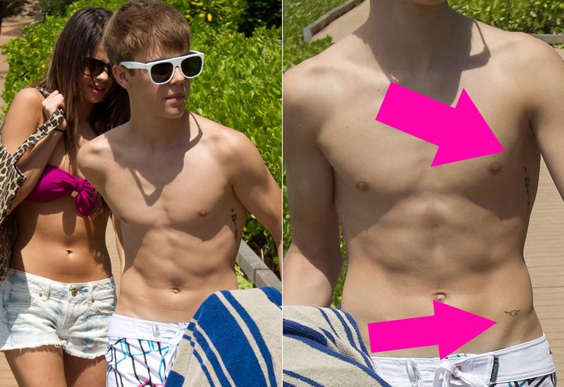 Biebers tatueringar – knappt synliga med blotta ögat. Här på semester med Selena Gomez.