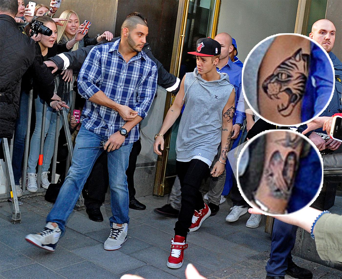 Justin Bieber visade upp sina nya tatueringar på väg till konserten i Globen på tisdagskvällen.