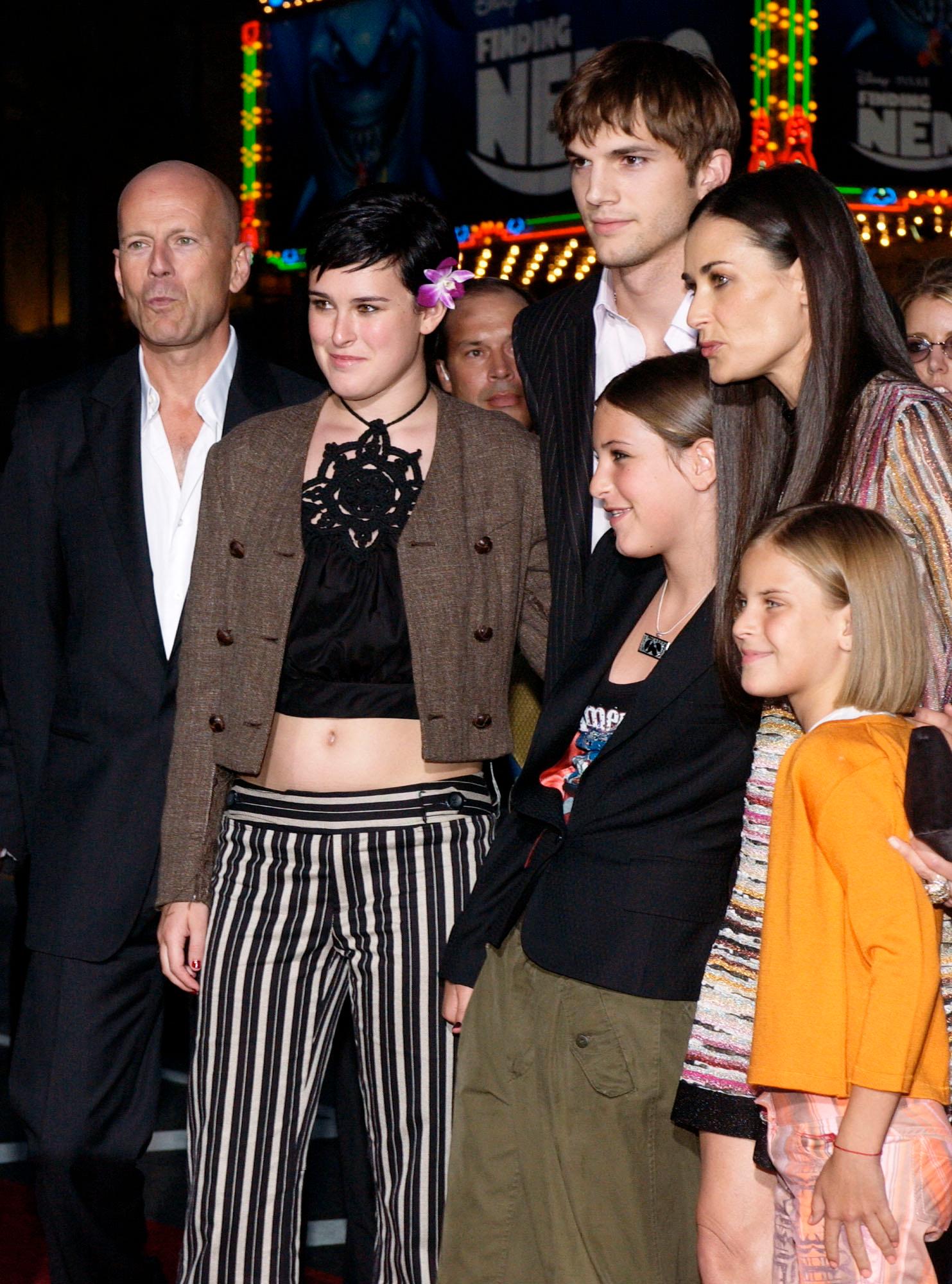 2003 Kutcher tog snabbt på sig rollen som styvpappa till Moores döttrar Scout, Rumer och Tallulah. Han blev också god vän med hennes exmake Bruce Willis.