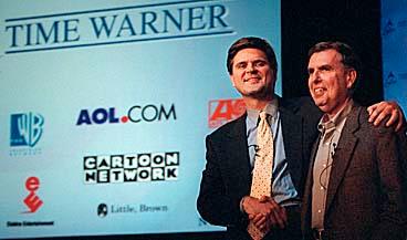 BILDAR MEDIEJÄTTE America Onlines vd Steve Case, till vänster, och Time Warners vd Gerald Levin skakar hand före en presskonferens den 10 januari i år, där de tillkännagav biljonaffären.