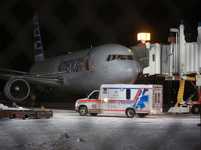 Flera fick föras till sjukhus när American Airlines-plan tvingades gå ned för landning på St Johns flygplats när besättning och passagerare blev sjuka.