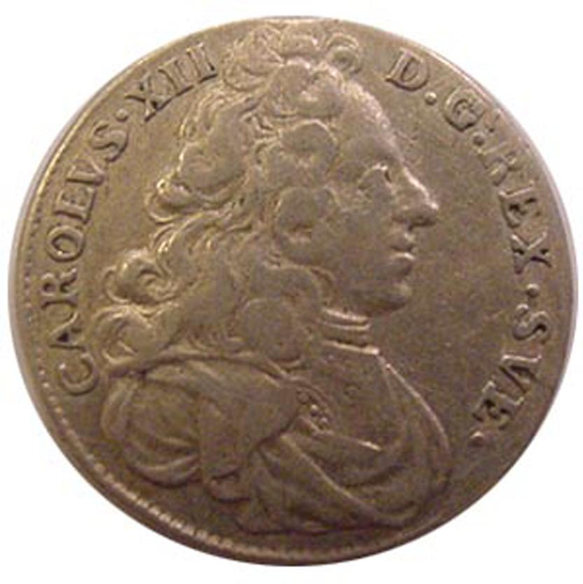 ... och med kort frisyr på ett mynt från 1714.