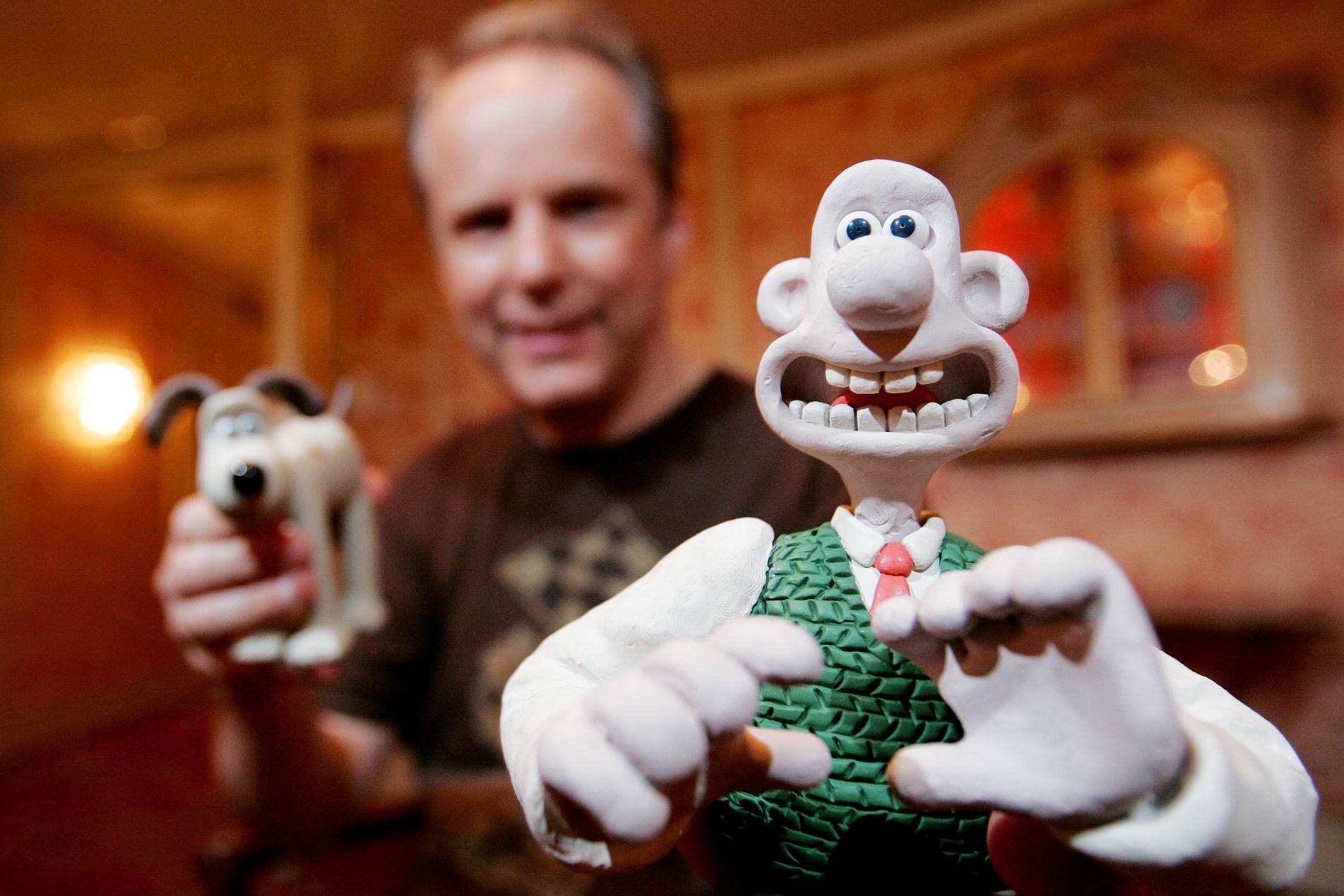 Animatören Nick Park med sina skapelser Wallace och Gromit. Arkivbild.