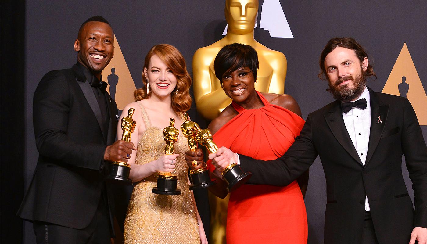 Fyra glada Oscarsvinnare.